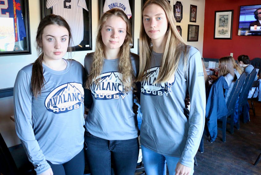 Grade 12 Avon View High School students and the senior girls’ rugby team co-captains Maya Cochrane, Jobean Boyd and Alison Dill are still coming to terms with the fact that their high school rugby careers have been cut short.