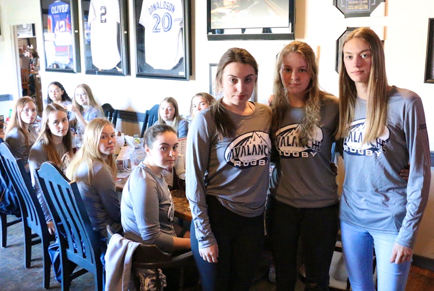 Maya Cochrane, Jobean Boyd and Alison Dill, co-captains of Avon View’s senior girls’ rugby team, said the girls had already planned a team bonding night at Bubba Rays in Windsor May 2. Prior to making it to the dinner, they learned the NSSAF banned high school level rugby that same day.