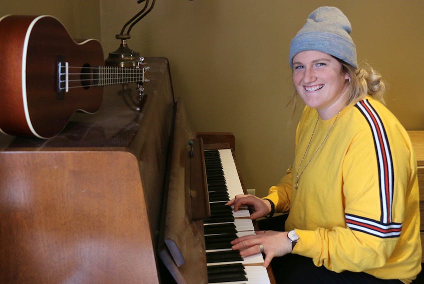 Emma Burry has been playing the piano since she was five years old. When she’s visiting her parents in Greenhill, she often can be found tickling the ivories.