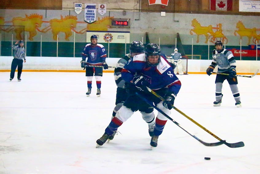 The Windsor Royals were on fire when they hosted the Spryfield Attack March 3 in Windsor. Pictured wheeling the puck up the ice is Brett Verge.