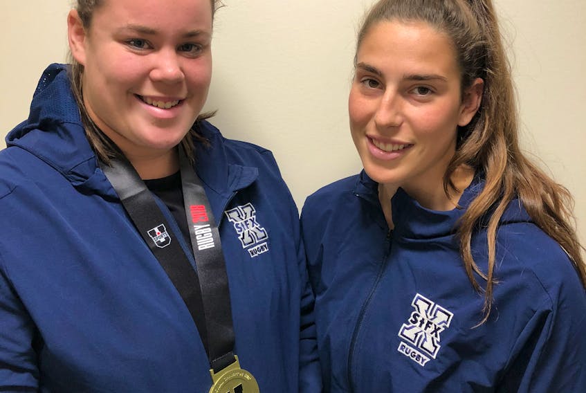 Sam Lake, left, and Sophie Parker both began their rugby careers while attending Avon View High School. As university student-athletes, they now have a U SPORTS national championship title to be proud of.
