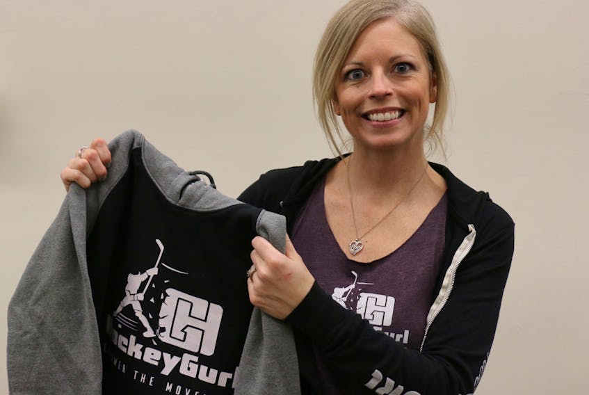 Natalie Ross displays some merchandise she’s created for her Hockey Gurl Custom Apparel business. She hopes the line of clothing will empower and inspire young girls playing the sport.