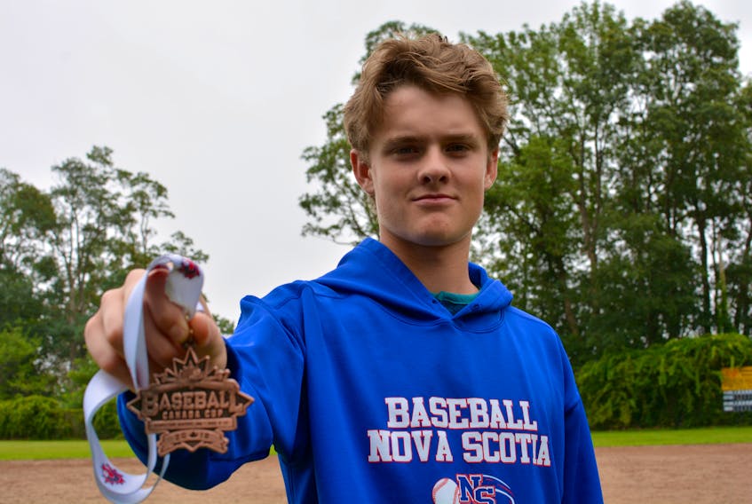 Layton Cuvilier, 16, from Hantsport, showcases a bronze medal that he received at the recent the U17 national championship.