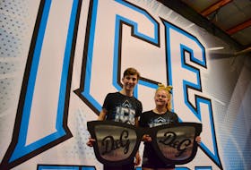 Jaiden Mosher, 13, of Beaver Bank, poses with one of her fellow cheermates Liam Salsman, 15, from Mount Uniacke. They’re holding a large prop that is used within the routine. Both Mosher and Salsman enjoy the camaraderie that ICE provides.