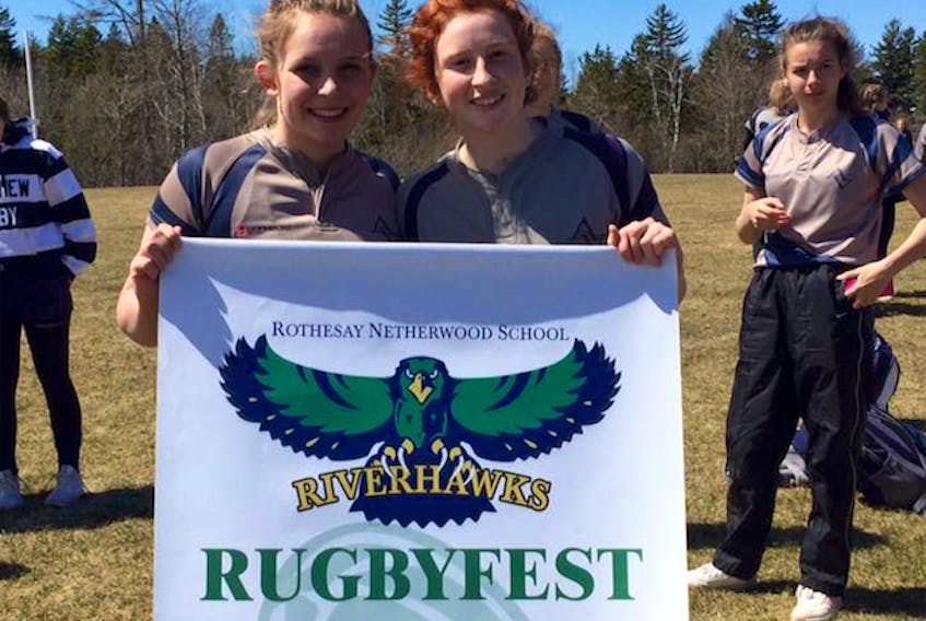 Avon View's captains Briana Hennigar and Paige Parker show off the banner they won at the Rothesay Netherwood School's annual rugbyfest.