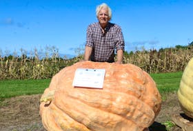 Tom Dudka, of New Glasgow, was all smiles when his pumpkin, nicknamed Trump, placed fifth overall with a weight of 1,051 pounds (477 kg).