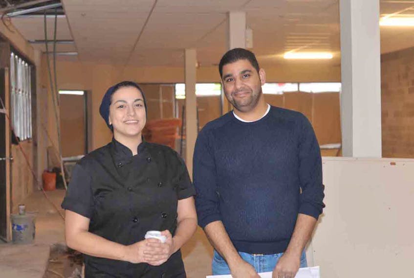 The Kettle Black is expanding into a 3,600 square-foot space at 135 Kent Street, near Tim Hortons, in the new year and possibly as soon as March. Kettle Black’s head chef Tina Marar, left, and owner Mazen Aldossary look over the interior of the building. TERRENCE MCEACHERN/THE GUARDIAN
