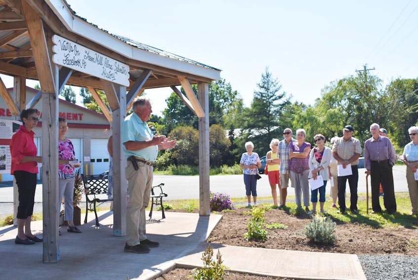 Warden Robert Parker speaks to a crowd gathered for the ribbon cutting at the Green Hill-Alma Historical Kiosk Saturday, Sept. 15.