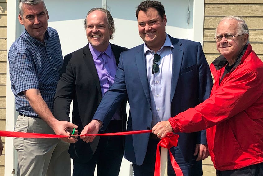 Annapolis MLA Stephen McNeil, Annapolis County Warden Timothy Habinski, and West Nova MP Colin Fraser cut the ribbon on Bridgetown’s new well June 24. Right is municipal Councillor Alex Morrison.