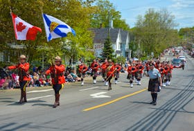 The RCMP Pipes and Drums were well represented in the Apple Blossom Festival Grand Street Parade in Kentville. - Kirk Starratt