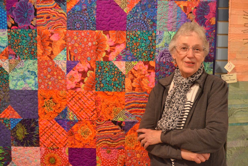 Quilter Ruth Butler of Wolfville with “Fit for a Princess.” Made from fabric designed by Kaffe Fassett, the quilt is one of several pieces she has on display as part of a new exhibit at the Kings County Museum in Kentville.