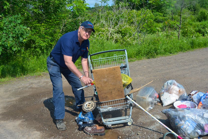 A frustrated Gerard Hamilton examines one of the most recent illegal dumpings at the end of Jones Road in New Minas. Hamilton is urging those responsible to come forward and clean the trash up before law enforcement officials get involved. SAM MACDONALD