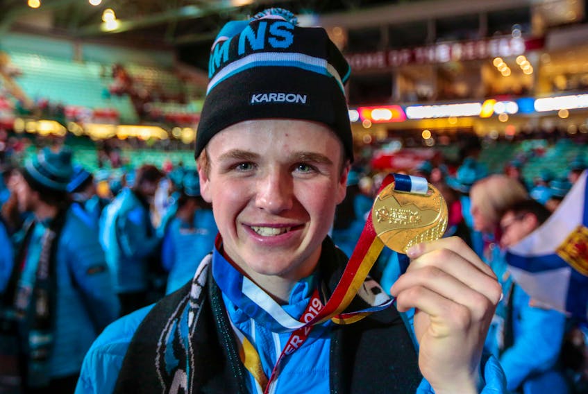 Shane Sommer shows off his hardware at the closing ceremony of the Canada Games in Red Deer, Alta. The Port Williams athlete medaled in alpine ski cross just hours before the closing ceremonies began March 2, earning Team Nova Scotia’s only gold medal. Communications Nova Scotia/Len Wagg