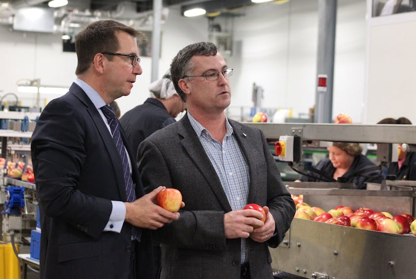 Kings-Hants MP Scott Brison, left, and Scotian Gold president and CEO David Parrish tour the new production technology at Scotian Gold in Coldbrook. Brison visited Oct. 27 to officially announce $1.75 million in federal government funding toward a 28,000 square foot expansion at Scotian Gold that has been in production since the spring of this year.