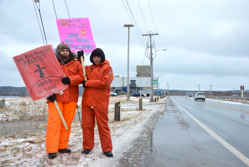 Sara Swinamer, right, and her daughter Chey protested on the Annapolis Royal causeway in January. Their concerns were with fish kills and ecological damage caused by the tidal power plant for more than 30 years. The plant has been shut down by the Department of Fisheries and Oceans under a section of the Fisheries Act that deals with harm to fish.