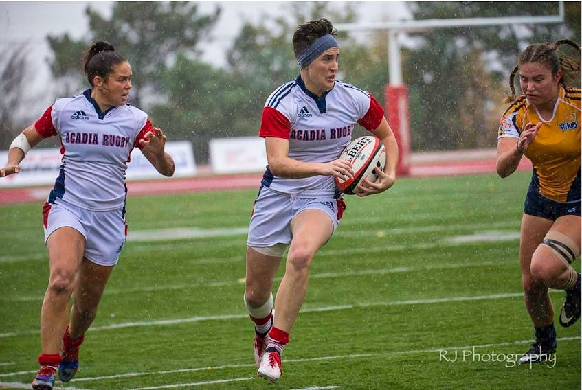 Amanda Jardine of Greenwood, left, played her first season of rugby with the Acadia Axewomen this year at the age of 30.