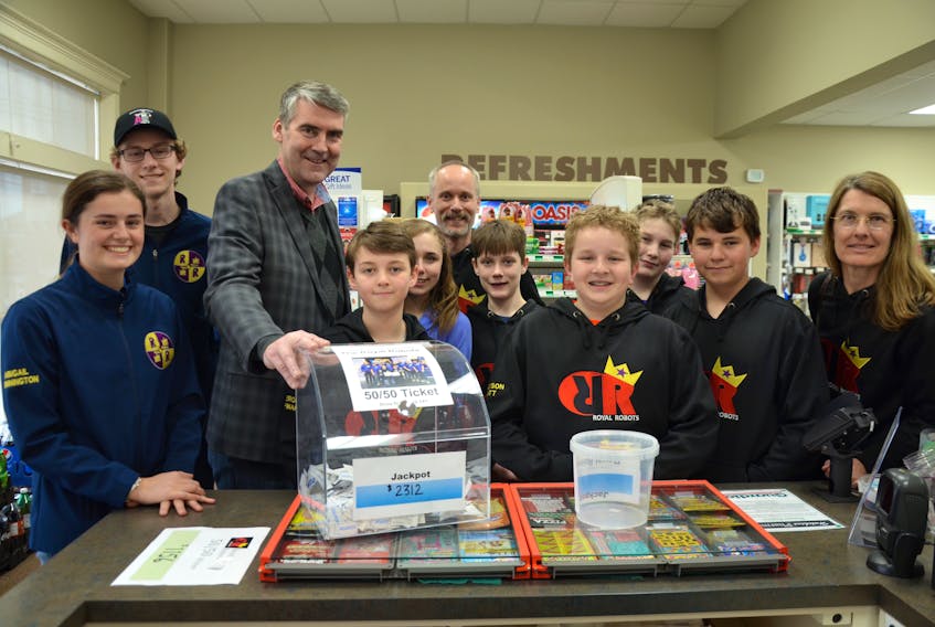 Nova Scotia Premier Stephen McNeil dropped by the Guardian Pharmacy in Annapolis Royal recently to draw the winning ticket in a 50/50 draw, a fundraiser for the Annapolis West Education Centre Royal Robots teams that are heading to Detroit to take part in several world competitions after both the schools junior and senior robotics teams won provincials at Acadia recently.
