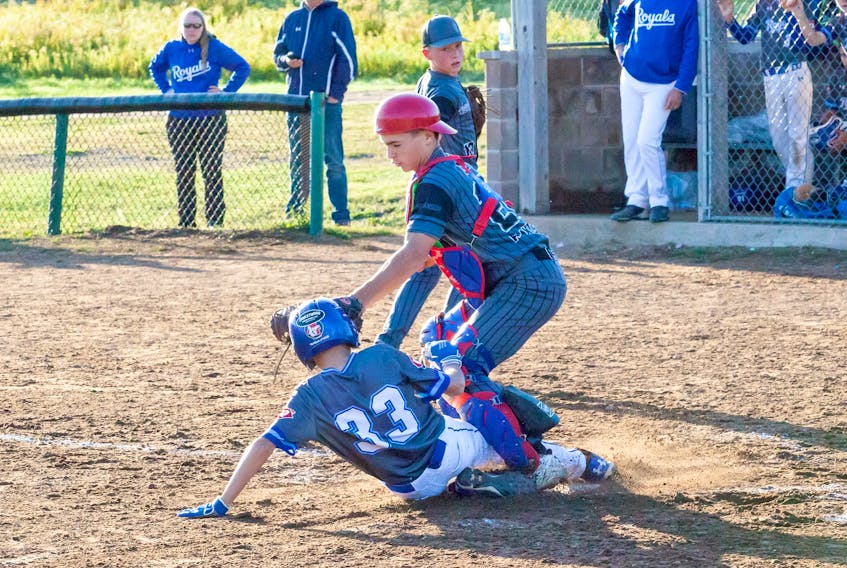 Springhill Fencebusters catcher Kieran Sears tags a Fredericton DQ Blizzards baserunner in U13 AA Atlantic baseball championship action on Friday. Springhill lost 4-3 to the New Glasgow DQ Blizzards in the Atlantic final on Sunday.