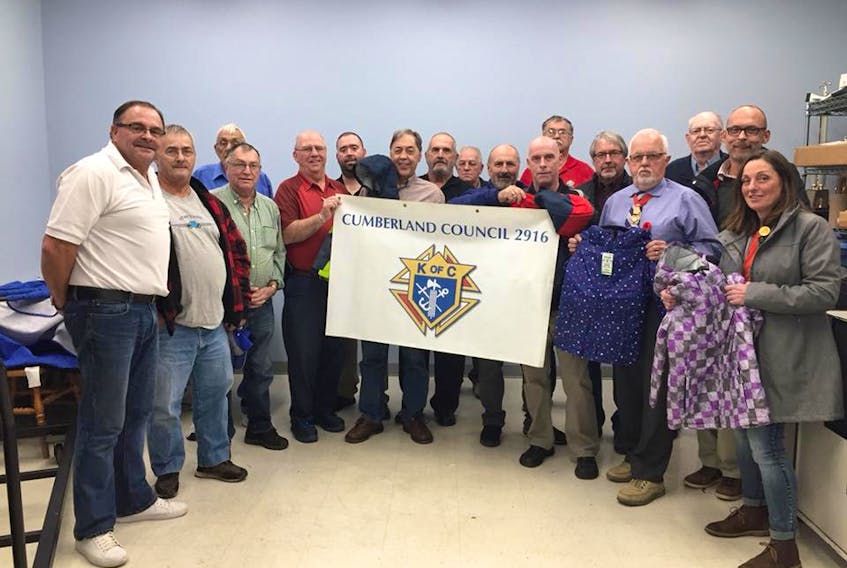 Members of the Amherst Knights of Columbus Council 2916 presented 96 jackets to representatives from Empowering Beyond Barriers and Coats for Cumberland during a recent meeting. This is the second time in three years the organization has supported the annual campaign.