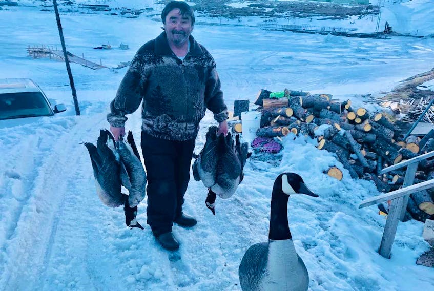 Ross Flowers with his goose and duck harvest. Foreground decoy is not part of his limit.