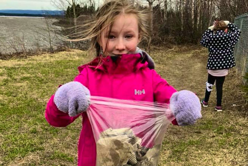 The 2nd Happy Valley Brownies and the 2nd Happy Valley Guides took part in the May 30 Community Clean-up. Katelyn Chislett with the Guides was one of those who helped out.