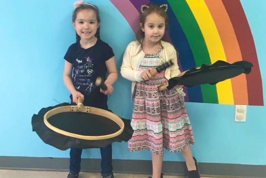 Avery Elliott (left) and Tegan Lethbridge practicing their drumming during the Aboriginal Family Centre’s programming in the Spring of 2018.