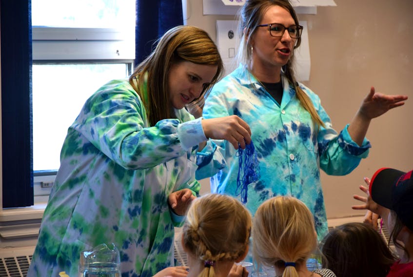 Marilyn Cribb, left, and Caitlin Lapalme showed science-based magic tricks for the kids.