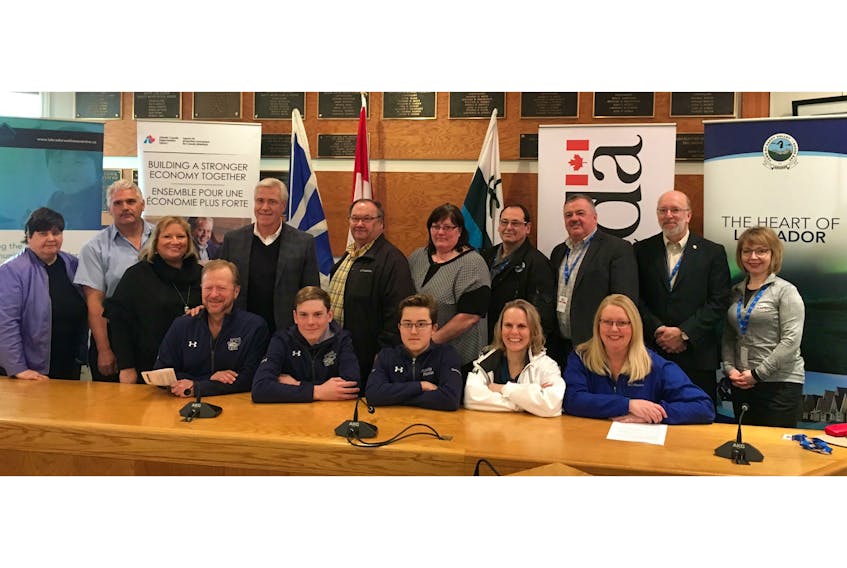 Members of the Melville Mantas swim club, seen in front, were on hand for the funding announcement.  Federal, provincial and municipal politicians were also present.