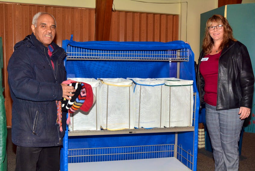 Brian Bowden, chair of Viola’s Place Society Board and Kim Davidson, Glen Haven Manor’s Manager of Environmental, Maintenance & Nutritional Services, are pictured looking over one of the linen carts recently donated to Viola’s Place by Glen Haven Manor.