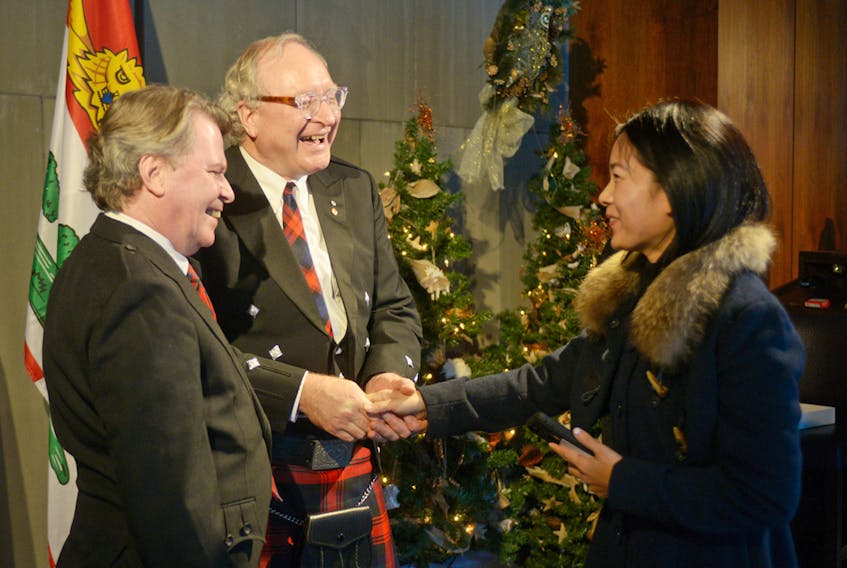 Duncan McIntosh, from left, and Wade MacLauchlan greet Mandy Jin during the premier’s levee held inside the Confederation Centre of the Arts on New Year’s Day. MITCH MACDONALD/THE GUARDIAN