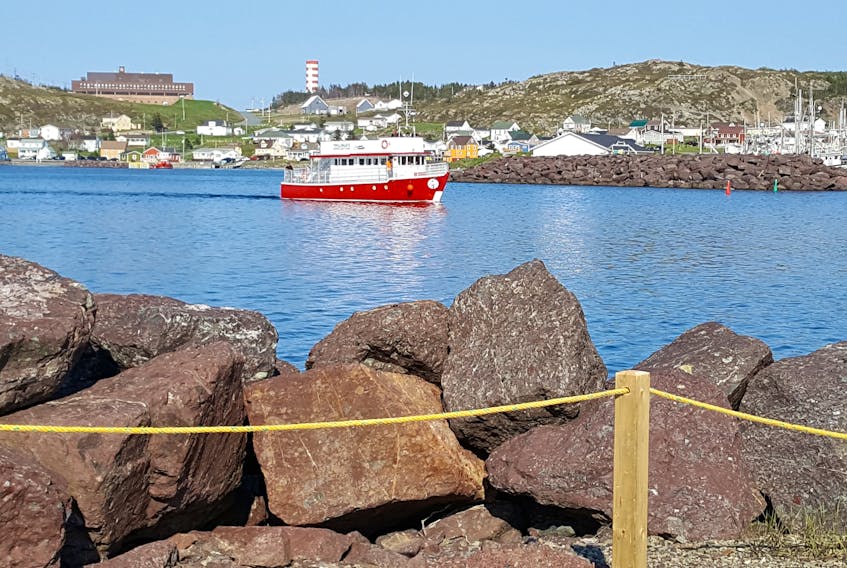 The Twillingate Adventure Tours boat allows tourists to observe the spectacular coastline, whether or not they see an iceberg.