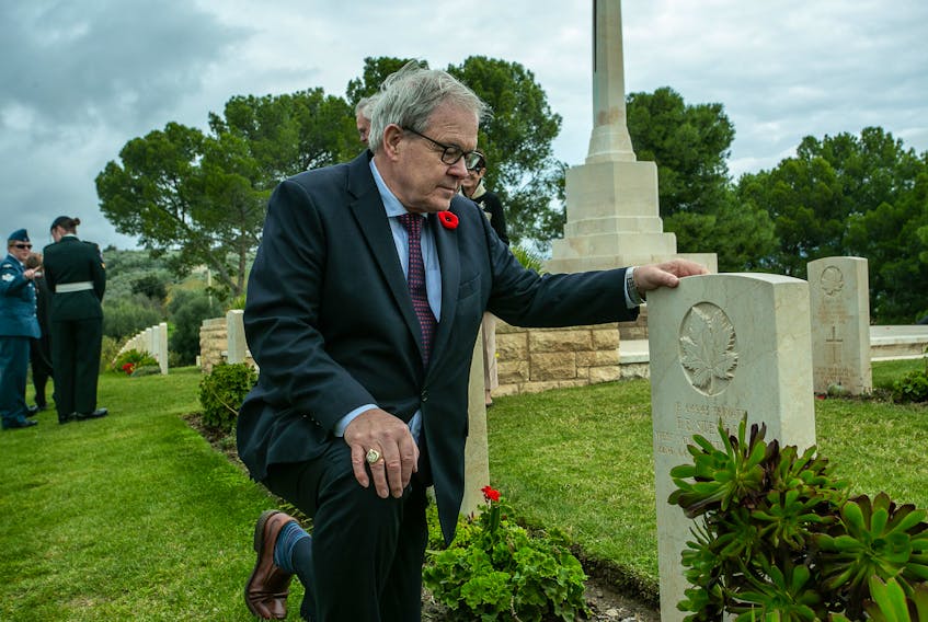 Veterans Affairs Minister Lawrence MacAulay visits the grave of Private F.B Stewart of Murray Harbour while in Italy to commemorate the 75th anniversary of the Italian campaign.