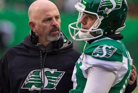 Saskatchewan Roughriders head coach Craig Dickenson, left, encourages Brett Lauther after one of his four missed field-goal attempts in Saturday’s 23-13 victory over the visiting Edmonton Eskimos. BRANDON HARDER / REGINA LEADER-POST