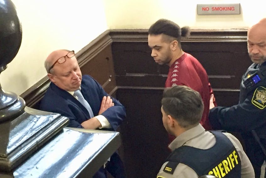 Leslie Burton Gray confers with his lawyer, Patrick Eagan, at Halifax provincial court Tuesday before pleading guilty to four counts of human trafficking.