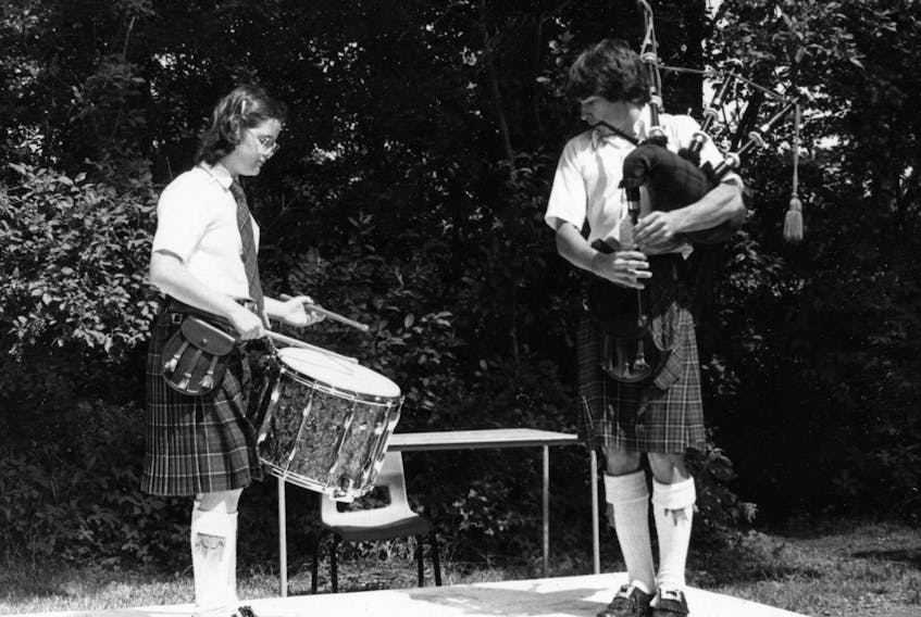 Lianne Bradshaw of Antigonish practices with Neil Kell for her upcoming drumming competition at the Antigonish Highland Games. During her solo competition career at the Games, Lianne was regularly awarded drummer of the day, winning her grade for five straight years on the way to claiming the professional class title in 1992. Lianne has led the drum corps of the Clan Thompson Pipe Band which won the Grade 3 North American Championships in 1989. She also instructed the drummers of the youthful Antigonish Highland Society Pipe Band which won championship supreme in Atlantic Canada in Grade 4 from 1993 to 1995 and in Grade 3 in 1996, and captured the Grade 4 North American Championship in 1995. Archie MacLellan