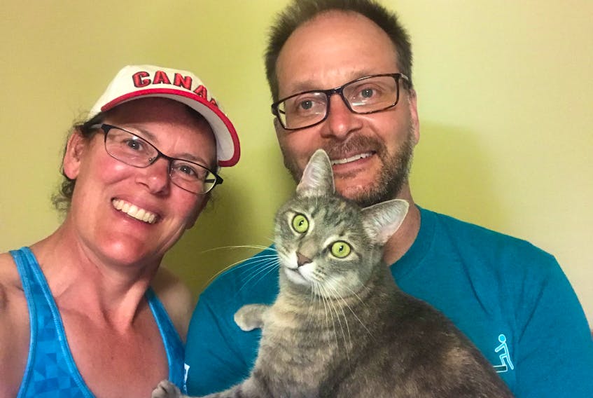 Lloyd McLean and his wife Andrea Haughan are pictured with Ariel a cat they adopted from the Pictou County SPCA in March.