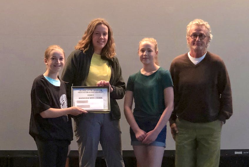 Members of the Marshview Mighty Earth Warriors, l-r, Quinn MacAskill, Jane Coates and Beth Thompson are presented with the 2019 Jack Layton Award for Youth Action in Sustainability from Chris Porter, a consultant for Learning for a Sustainable Future.