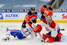 Montreal Canadiens goaltender Carey Price makes a save on Edmonton Oilers winger Kailer Yamamoto during a recent NHL game in Edmonton.