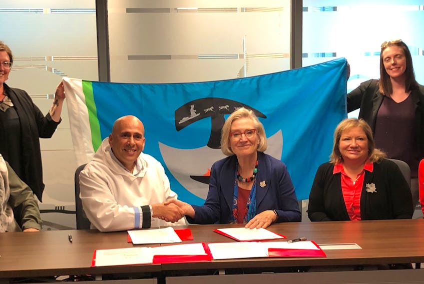 Nunatukavut Community Council president Todd Russell joined federal Minister of Crown-Indigenous Relations Carolyn Bennett, centre, and Labrador MP Yvonne Jones, along with members of NCC, at the signing of the memorandum of understanding. CONTRIBUTED/THE LABRADOR VOICE