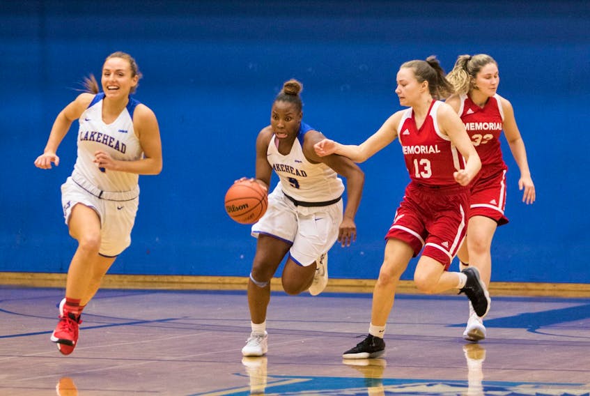 Erin Long (13), Gabrielle Roche (32( and their teammates on the Memorial Sea-Hawks womwn'a basketball team kept up with the competition during preseason play at Lakehead University. — Lakehead Athletics