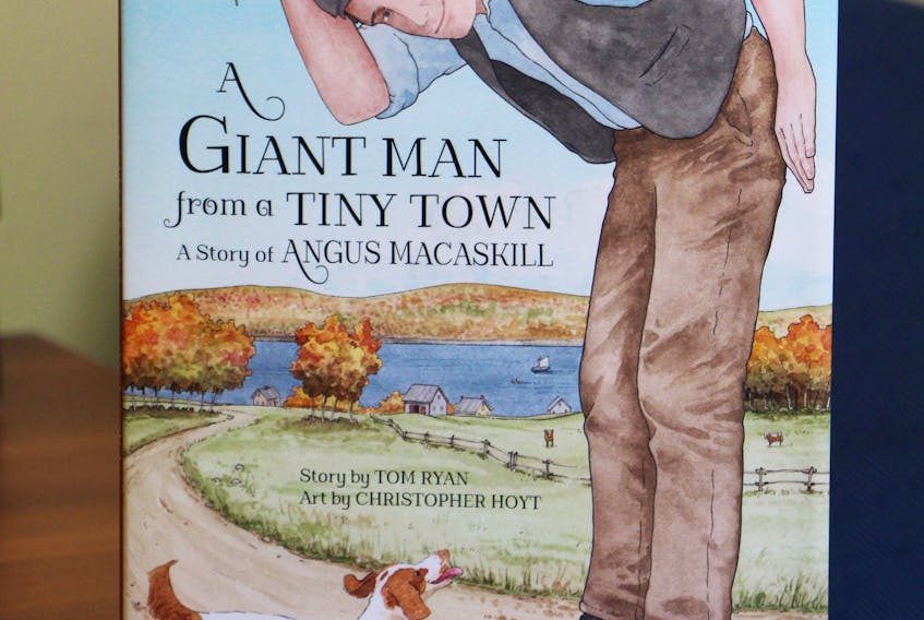 The clever cover illustration by artist Christopher Hoyt for A Giant Man from a Tiny Town; A Story of Angus MacAskill.