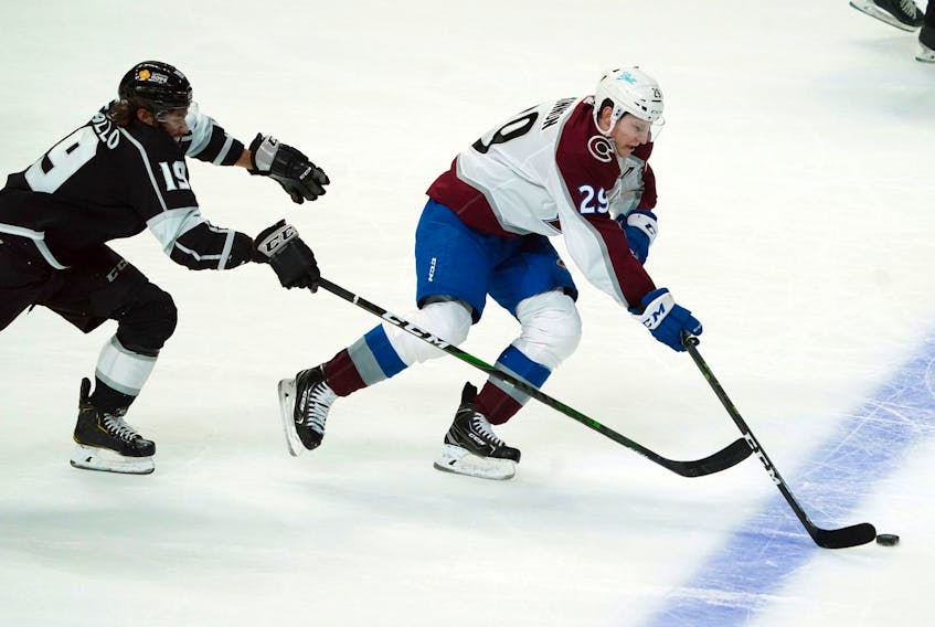 Colorado Avalanche centre Nathan MacKinnon (29) outraces Los Angeles Kings winger Alex Iafallo (19) for the puck during the first period of their NHL game Thursday night at the Staples Center in Los Angeles. Kirby Lee / USA Today Sports