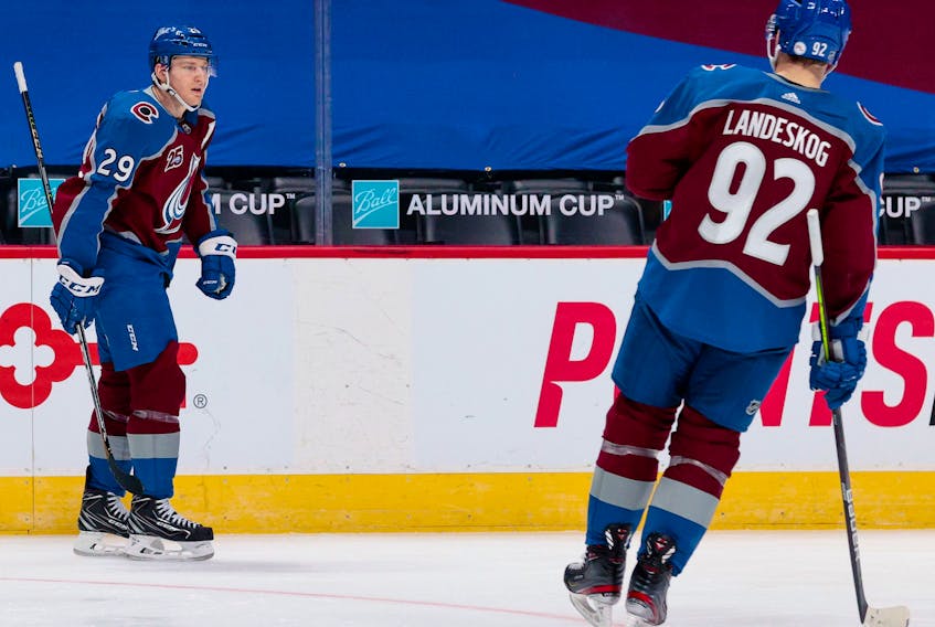 Colorado Avalanche centre Nathan MacKinnon (left) celebrates with winger Gabriel Landeskog after scoring a goal against the St. Louis Blues in the third period in Denver on Friday night. - Isaiah J. Downing / USA Today Sports