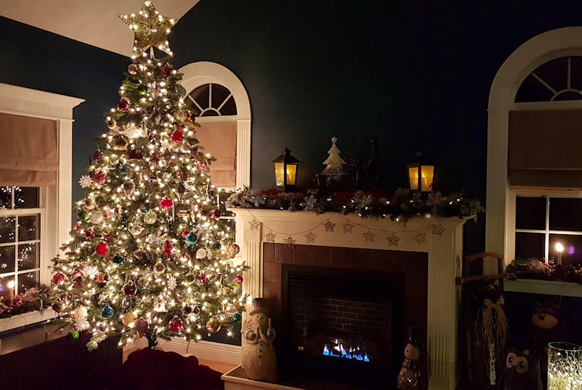 This festive living room photo with their 2017 tree and well-trimmed fireplace was submitted by Daniel Richard and Kim MacLeod.