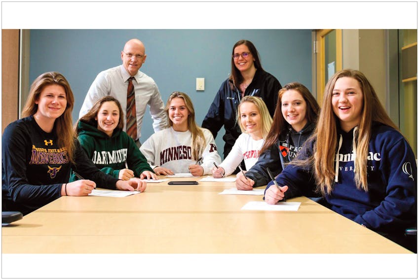 ssmathletics.org — It’s been a momentous month for Maggie Connors of St. John’s. On Thursday, the 17-year-old forward from St. John’s was named to the Canadian team that will compete in the 2018 world U18 women’s hockey championship in Russia. Last week, Connors (second from right), a senior at Shattuck-St. Mary’s school, signed her official letter of intent to attend Princeton University and play varsity hockey for the Tigers. Connors was one of six female hockey players players from the Fairbault, Minn., prep school to sign National Letters of Intent last Wednesday. Coaches Gordie Stafford and Melissa Boik look on as (from left) Abigail Levy (goaltender, Minnesota State University-Mankato), Givanna Foglia (defence, Dartmouth College), Gracie Ostertag (defence, University of Minnesota), Kiana Gilbraith (forward/defence, University of Wisconsin-River Falls), Connors and Courtney Vorster (defence, Quinnipiac University) all put pen to paper.