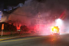 Firefighters battled a blaze at 823 Victoria Rd., in Whitney Pier Tuesday night. The now vacant structure one housed the office for the late former MLA Paul MacEwan.