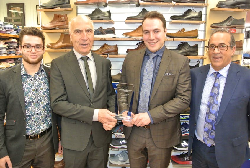 Robert Mansour and his son, Mikhial, hold up the award Mansour’s Men’s Wear received during the 12th Cedar and Maple Gala hosted May 16 by the Lebanese Chamber of Commerce in Nova Scotia. They are joined by staff members Alex Harrison (left) and Keith Cormier (right).