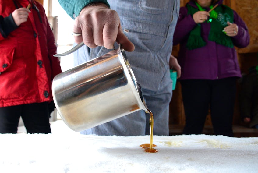 Don Donkin makes sugar-on-the-snow for tourists at the Donkin’s sugar camp in Fenwick. The lack of snow this season meant Donkin wasn’t able to make the treat for tourists after April 1.