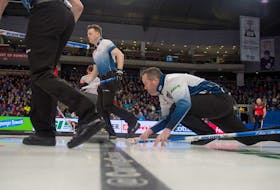 Nova Scotia skip Jamie Murphy makes a shot against Newfoundlan and Labrador's Brad Gushue during draw 3 at the Tim Hortons Brier on Sunday in Kingston, Ont. 
MICHAEL BURNS/ CURLING CANADA