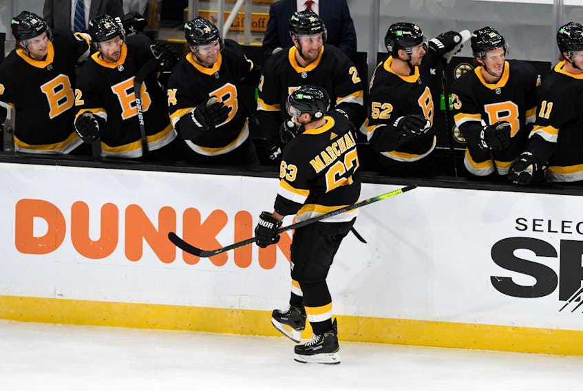 Boston Bruins forward Brad Marchand (63) celebrates with his teammates after scoring against the Pittsburgh Penguins during the first period at TD Garden in Boston. - Brian Fluharty / USA Today Sports